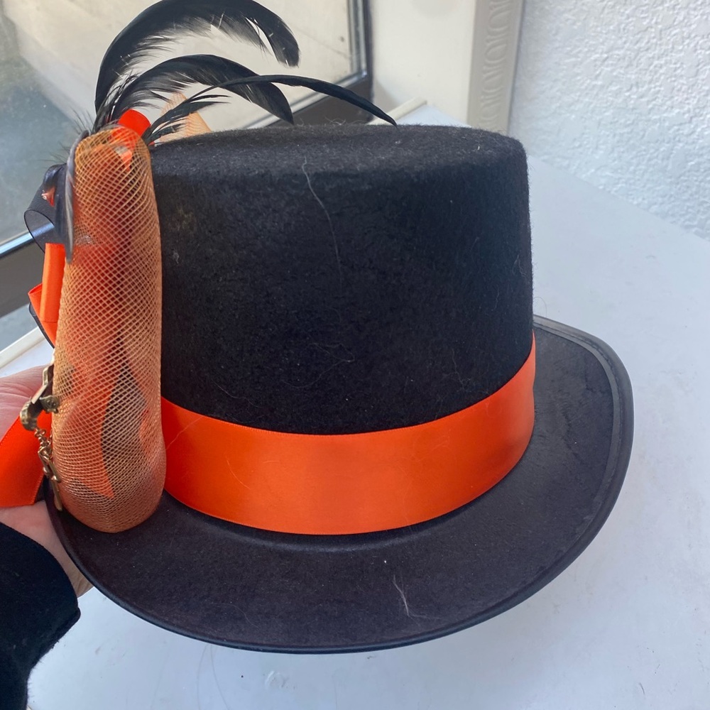 Elegant Black Hat with Orange Ribbon and Feather